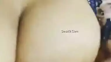 Desi woman in floral robe teases lover demonstrating big breasts