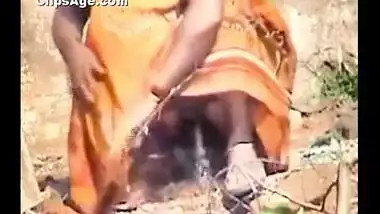 Indian desi Brick factory supervisor lady taking pee outside captured on video