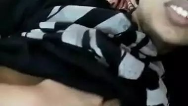 Young Indian woman with big sex eyes flashes her XXX tits in bed