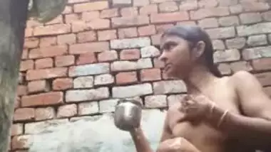 Young desi woman sets the camera on and starts her XXX shower show