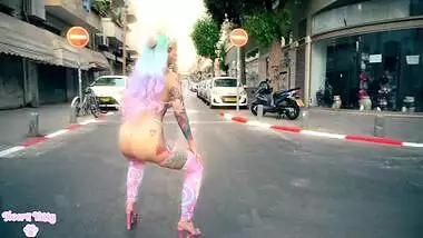 Colorful kawaii girl twerking in empty street during quarantine (no nudity)