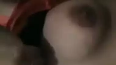 Pink T-shirt is pulled up so Indian sex girl can boast about her XXX tits