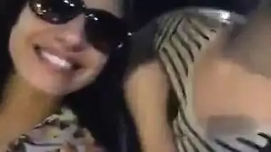 Two hot babes flash there boobs and kiss each other in moving car..