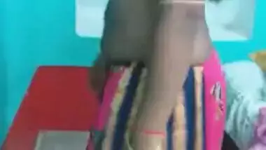 Hot like hell Desi female in sexy pink dress poses for the camera