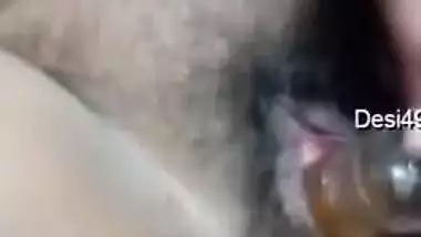 Fat Indian aunty fucks her own hairy twat with the new sex toy