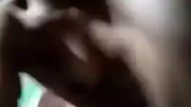 Naked Desi with dark skin does XXX porn on her own in the dark room