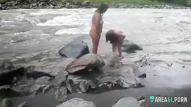 Voyeur sex clip two sexy desi aunty taking a bath outdoor by the river